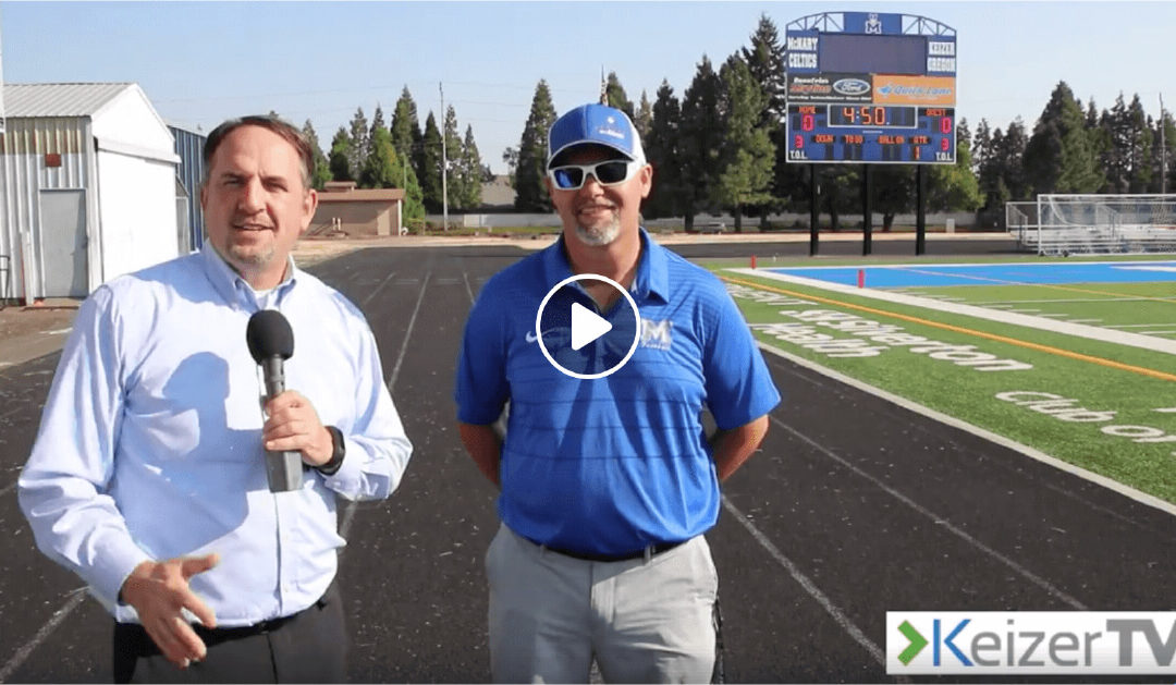 Image from Keizer TV with Jason Flores and a news reporter to discuss the new scoreboard at McNary High School